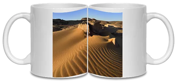 Sand dunes and sandblasted rocks on Tadrart plateau, Tassili nAjjer National Park, Unesco World Heritage Site, Sahara, Algeria
