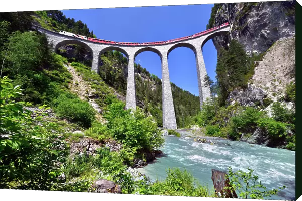 A train of the Rhaetian Railway on the Landwasser Viaduct, UNESCO World Heritage Site, near Filisur, Canton of Grisons, Switzerland
