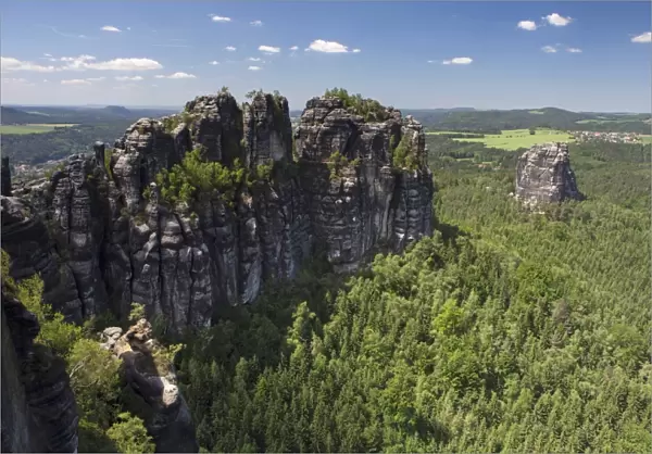 View of Schrammsteine ridge, jagged rock formation and Falkenstein rock, Elbe Sandstone Mountains, Saxony, Germany, Europe