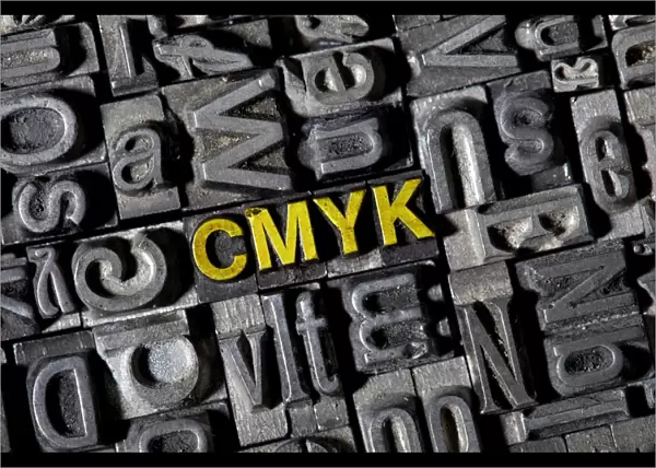 Old lead letters forming the word CMYK
