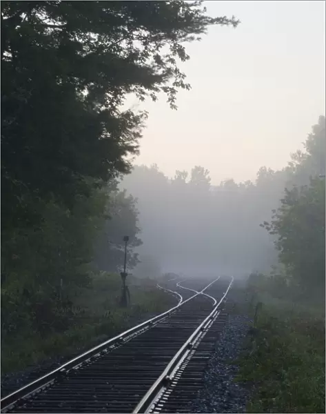 Railway tracks in early morning mist, Foster, Quebec, Canada
