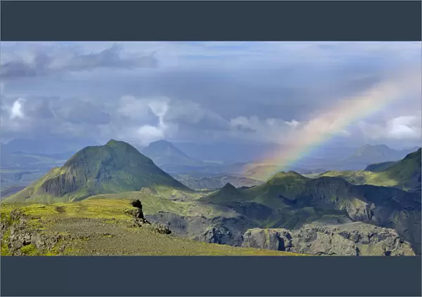Mountain plateau of Morinsheioi with a rainbow on the hiking trail from Skogar to Fimmvoerouhals, Porsmork, Iceland