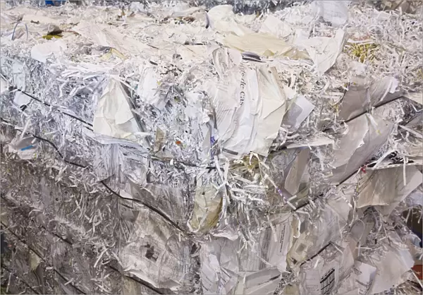 Bale of recyclable shredded office paper at a sorting centre, Quebec, Canada