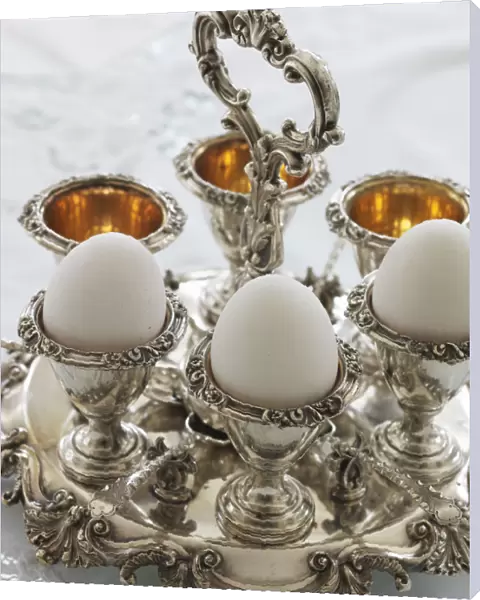 Antique silver egg cups in a sophisticated environment