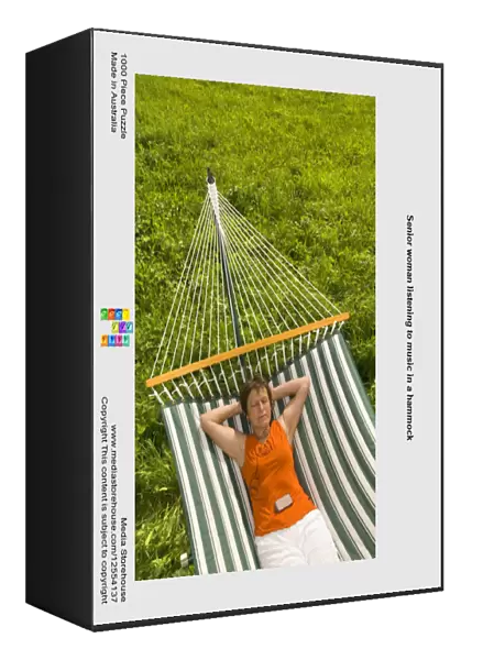Senior woman listening to music in a hammock