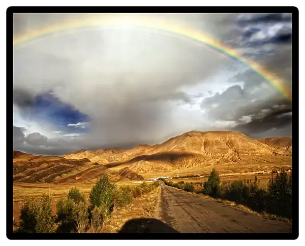 Rainbow after storm over Tingri, Tibet