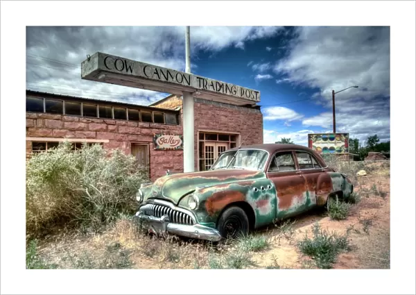 Abandoned 1950s car outside a desert trading post
