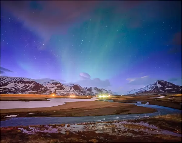 Wooden house on the background of the aurora in winter, Iceland
