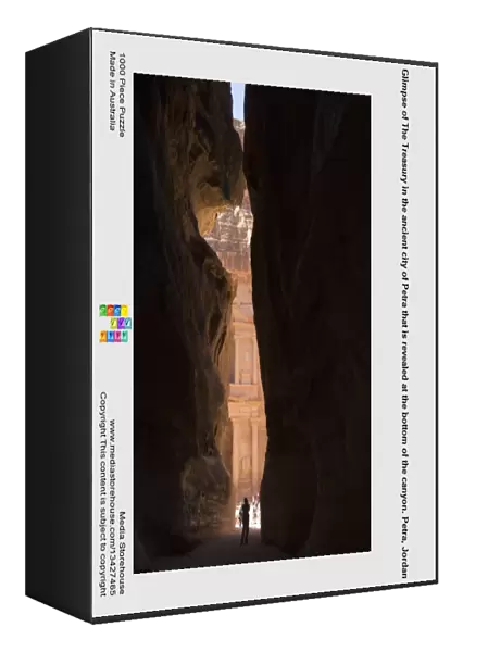 Glimpse of The Treasury in the ancient city of Petra that is revealed at the bottom of the canyon. Petra, Jordan