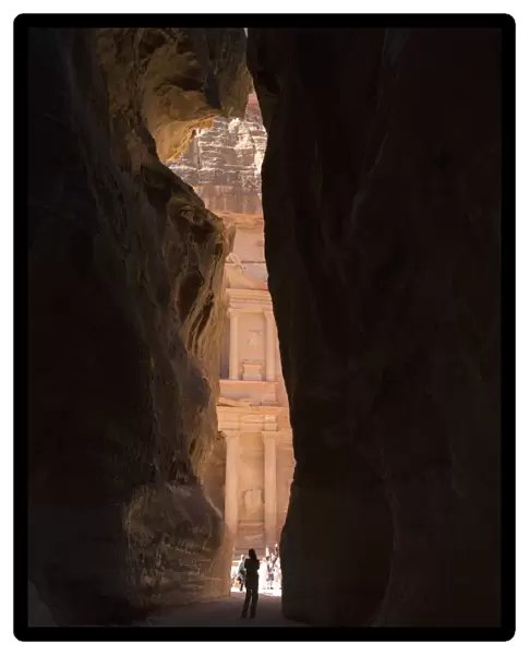 Glimpse of The Treasury in the ancient city of Petra that is revealed at the bottom of the canyon. Petra, Jordan