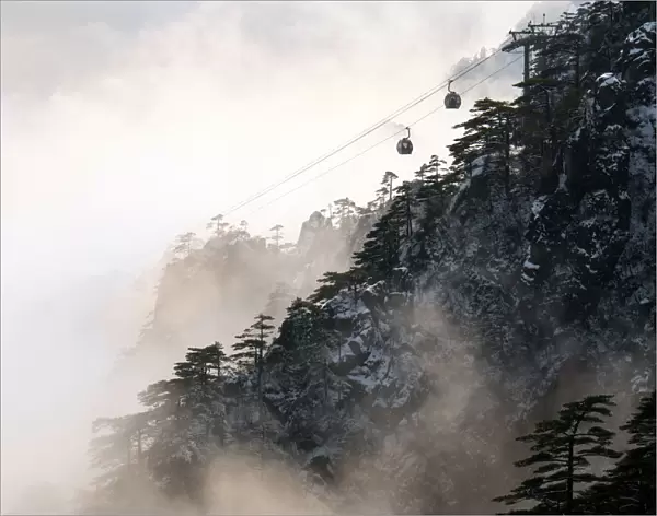 Cable car on Huangshan mountain in foggy day