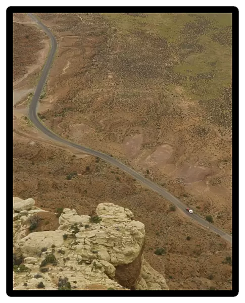 USA, Utah, SUV with trailer on desert highway, elevated view
