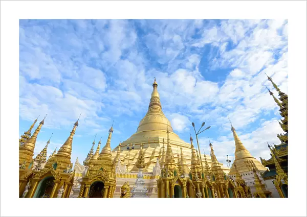 shwedagon pagoda under blue sky, yangon, myanmar