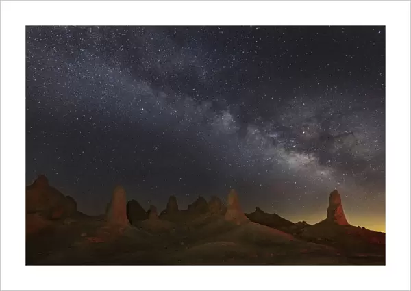 Milky Way and tufa towers of Trona Pinnacles at night, Mojave Desert, California, USA
