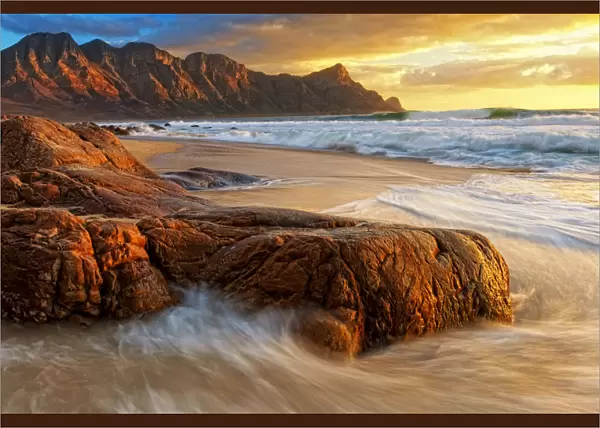 Dramatic Sunset over Kogel Bay in the Western Cape Province of South Africa with the Kogelberg Mountain Range forming a Stunning Backdrop