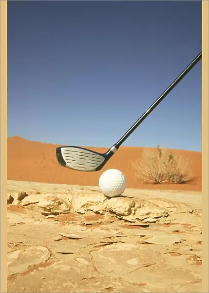 Golf Club and Ball on a Barren Desert Floor