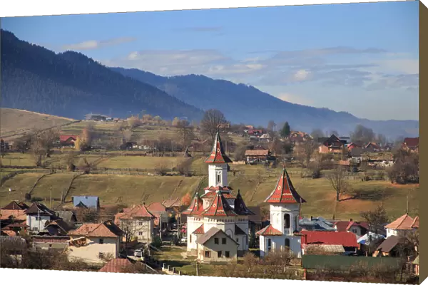 Autumn landscape of village and mountain range in background, Campulung Moldovenesc, Suceava County, Bucovina, Transylvania, Romania