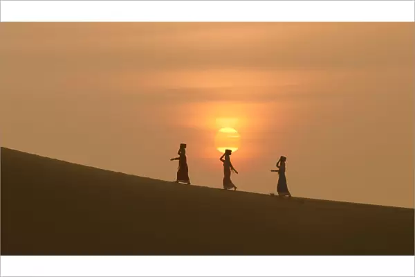 Minority Cham Girls on Sand Dune in beautiful sunsire  /  dawn
