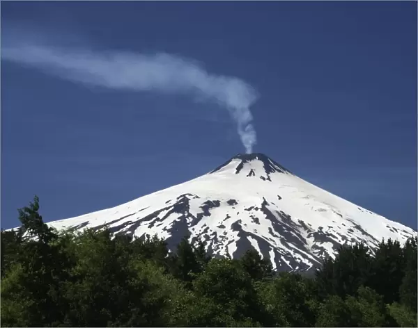 Volcanic smoke rising from Villarrica or Rucapillan Volcano, seen from Pucon, Chile