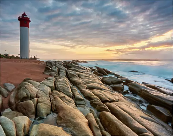 An early morning picturesque stratocumulus sky of the iconic Umhlanga Rocks Lighthouse