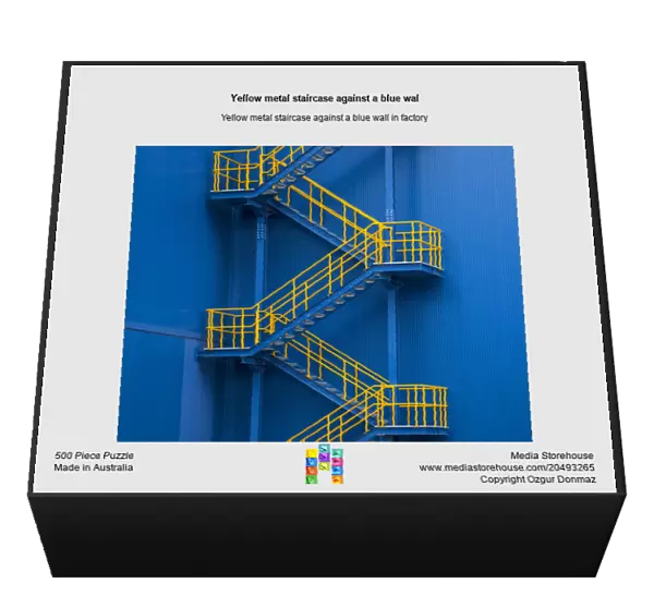 Yellow metal staircase against a blue wal