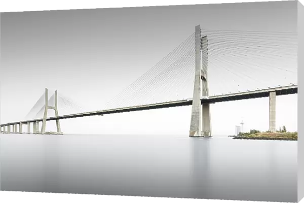 Minimalist long exposure of the famous Ponte Vasco da Gama bridge over the Tagus in Lisbon, Portugal