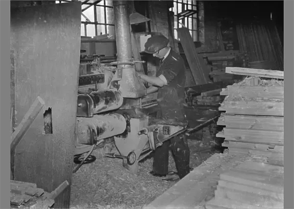 Machine work at the G Ellis joinery works in Hackney. 7 April 1938
