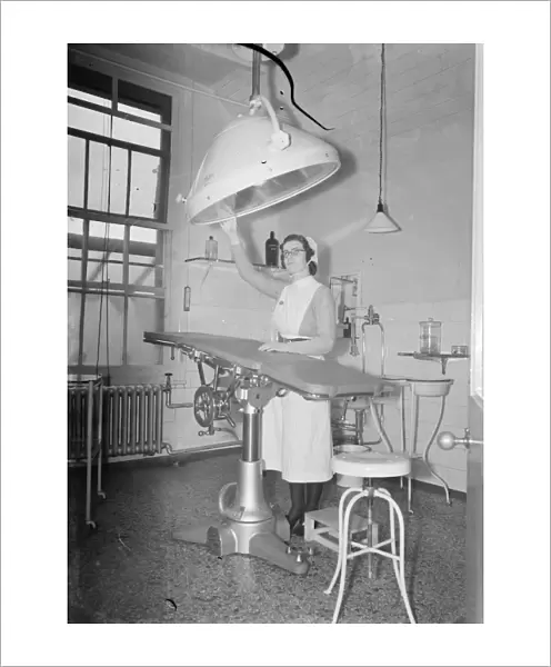 The Sidcup Cottage Hospital in Kent. A sister woking in the operating theatre