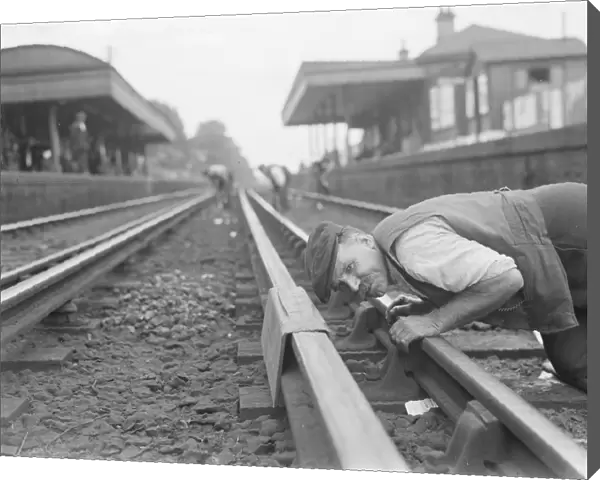 A railwayman gauging railway lines in Sidcup, Kent. 1937