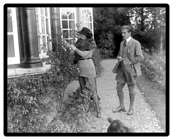Constance, Duchess of Westminsterand Captain Lewis in the garden of her New Forest