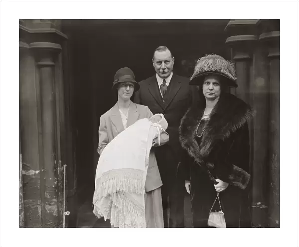 Lieutenant General Sir Travers Clarke and Lady Clarke ( with baby ) at the Christening