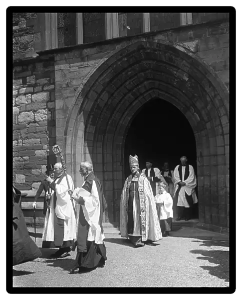 At St Asaph, Wales. Dr Edwards, first Archbishop of Wales leaving the cathedral