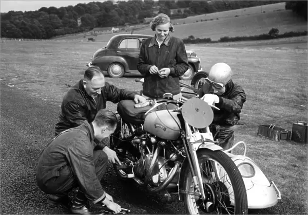 John Surtees and his family and friends get down to some motorbike maintenance at a race meeting