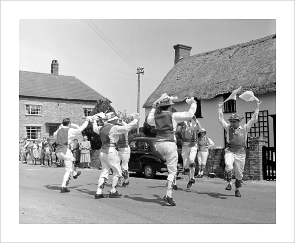 Morris Dancing in the street in Dorset, England, UK 1960 s