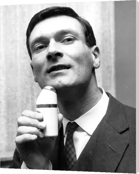 Elegant Shave Kenneth Grange of North London uses cordless electric shaver 22 May 1963
