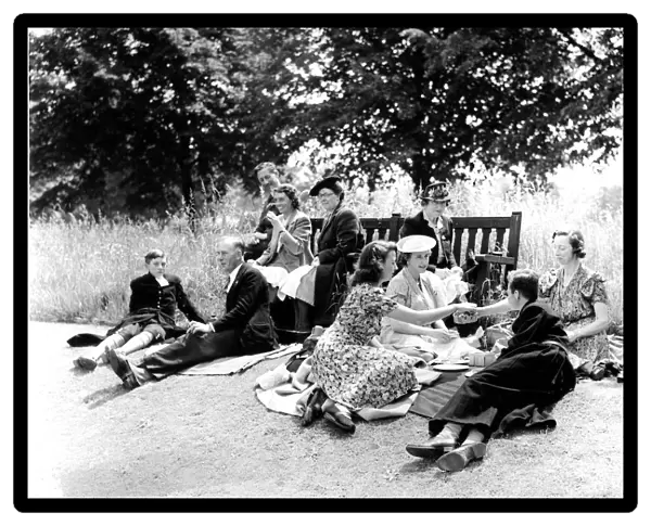 Pupils and parents picnic on the lawn at Christs Hospital School, Horsham, West Sussex