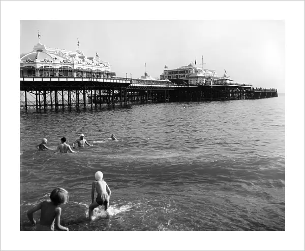 Brighton - enjoying paddling and swimming in the sea near the pier