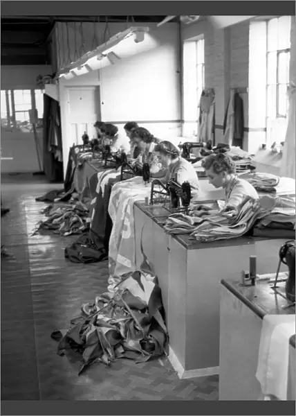 London Girl workers at an Old Kent Road Flag and Decorations making factory sew pieces