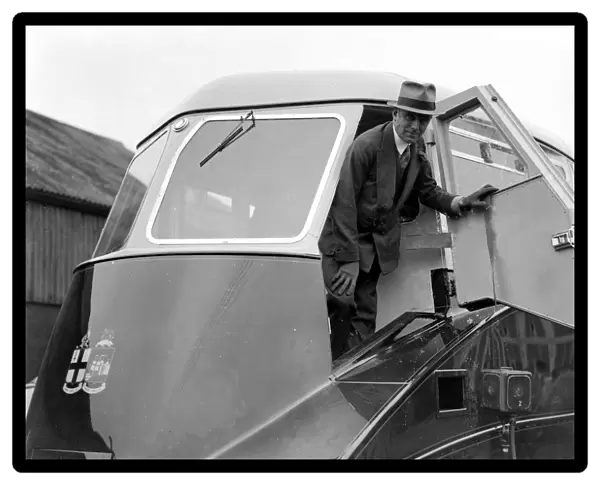 Earl Howe in the driving cab of the New Great Western Railway Steam Lined Railcar