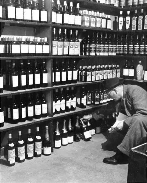 Man looking through the wines and spirits in the off licence department of the Globe Tavern