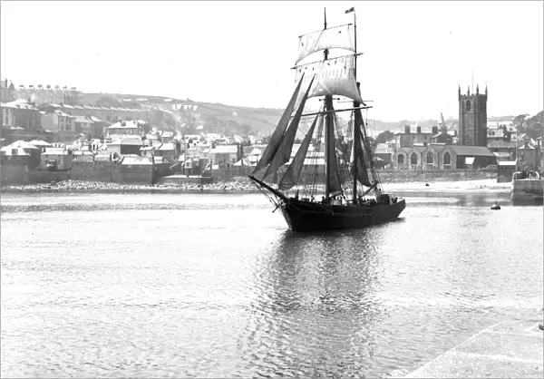 Unidentified topsail schooner underway leaving St Ives harbour, Cornwall. Early 1900s