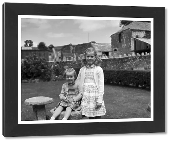 Little girls at Shillingham Manor Farm, St Stephens by Saltash, Cornwall. 1961