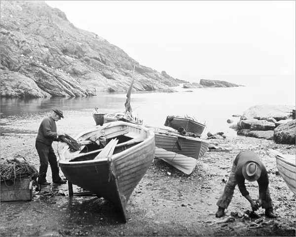 Beach at Portloe with six boats and fishermen working, Veryan, Cornwall. 1912