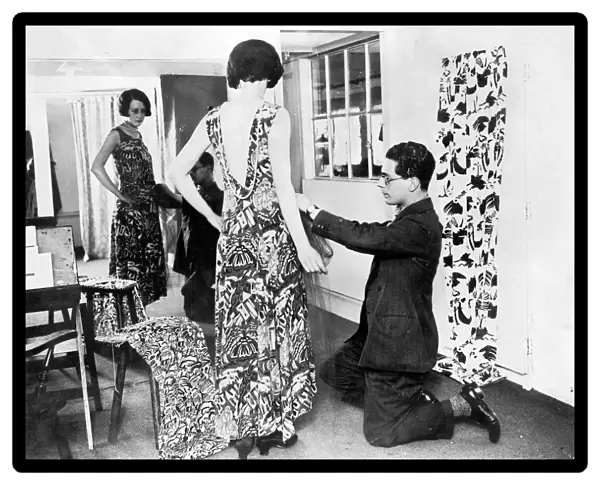 George Criscuolo fitting an evening gown of Crysede silk, St Ives, Cornwall. Around 1927