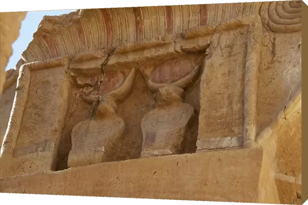 Uraeus or cobras protecting the pharaohs above the capitals of the columns. (relief)
