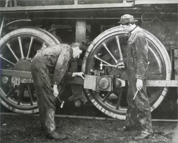 Maintenance work on a 4-6-0 locomotive of the Southern Pacific line