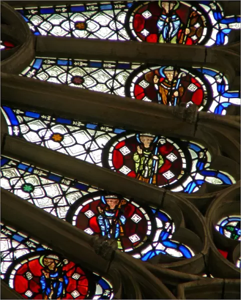 Window w121 depicting bishops, kings, martyrs in a section of the rose window