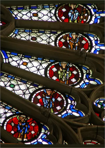 Window w121 depicting bishops, kings, martyrs in a section of the rose window