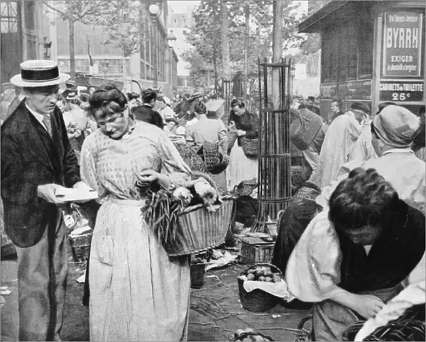 Hawker among the buyers and sellers, Les Halles, Paris, 1896 (b  /  w photo)