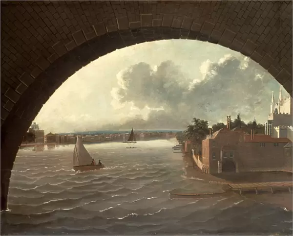 The Thames at Westminster seen through the arch of a bridge